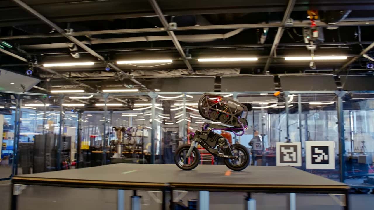 A robot and motorcycle in a monochrome personal photograph